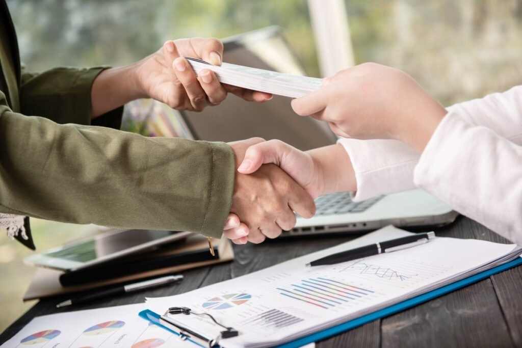 Business contract signing and handshake