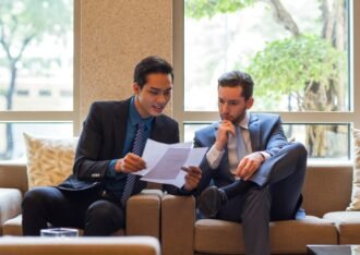 Business professionals reviewing contract documents